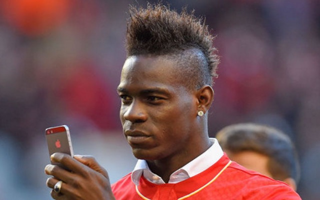 Mario Balotelli taking photo on his phone