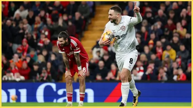 Adam Phillips celebrates his goal against Liverpool at Anfield