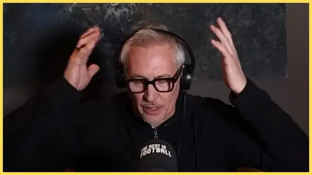 Gary Lineker puts his hands up around his head.