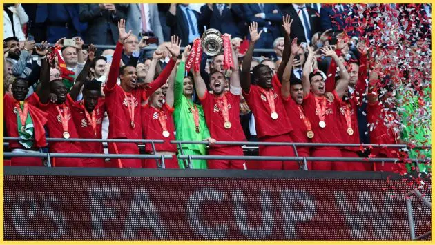 Liverpool players celebrate winning the FA Cup in 2022