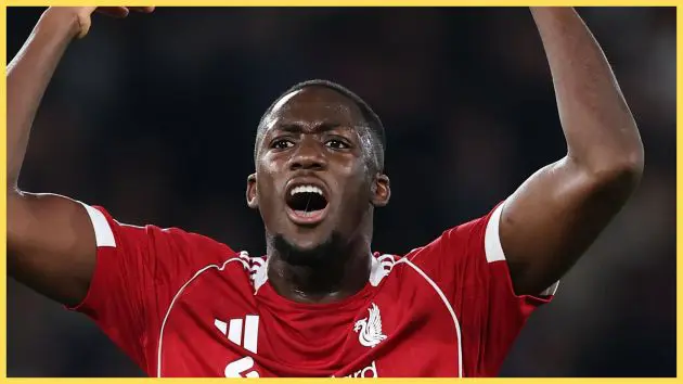Ibrahima Konate screams and throws his arms up during Liverpool game.
