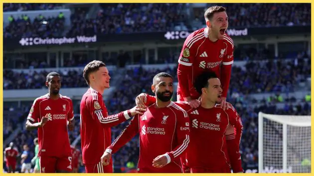 Mo Salah celebrates with Liverpool teammates.