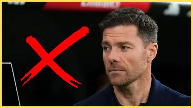 Xabi Alonso looks on next to a giant red X.