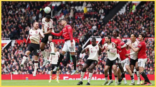 Cody Gakpo and Casemiro contest an aerial duel at Old Trafford
