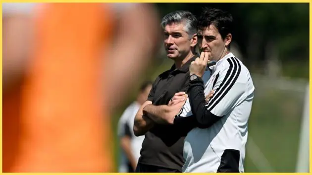Richard Hughes and Andoni Iraola watch on as the Liverpool players are put through their paces in training