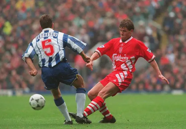 Stig Inge Bjornebye gets his pass away under pressure from Dan Petrescu